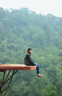 Man on mountain against sky