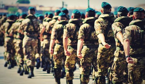 Army soldiers marching during parade on street