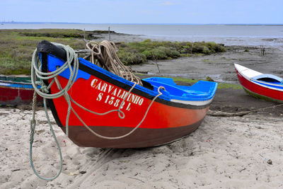 Fishing boats moored at beach