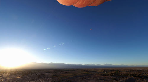 Scenic view of landscape against clear blue sky