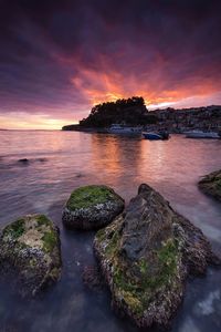 Scenic view of sea against dramatic sky