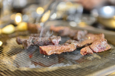 Close-up of meat on barbecue grill