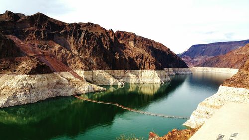 Calm lake along rocky landscape