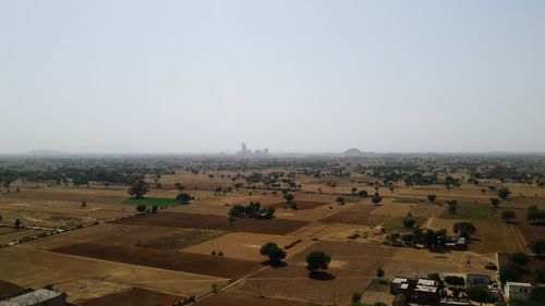 High angle view of agricultural field against clear sky