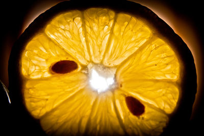 Close-up of lemon slice against black background