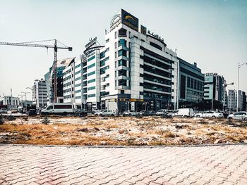 View of buildings in city against clear sky