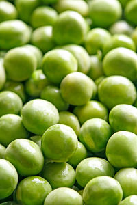 Full frame shot of wet green peas