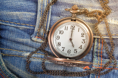 High angle view of clock on jeans