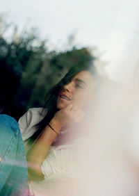 Portrait of young woman looking away