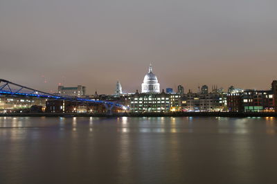 Illuminated city at waterfront