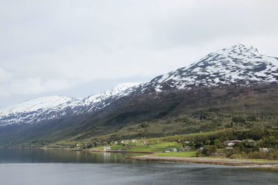 Scenic view of snow covered mountains against sky