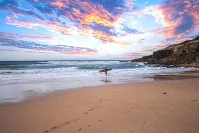 Scenic view of beach against sky