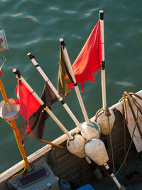 High angle view of flags on wooden post