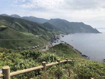 Scenic view of landscape and mountains against sky