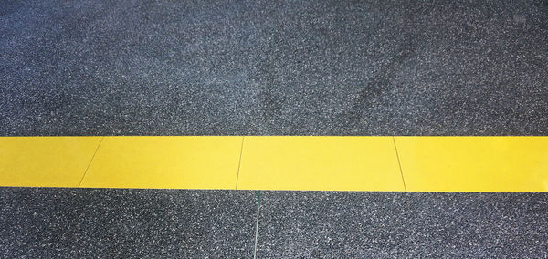 High angle view of yellow line on road