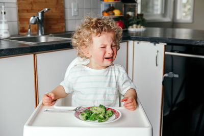 Portrait of cute baby at home