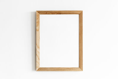 Close-up of empty chair against white background