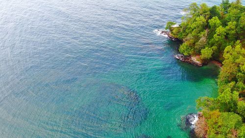 High angle view of rocks by sea