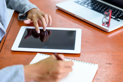 Low angle view of person using mobile phone