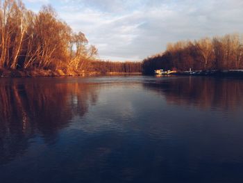 Scenic view of lake against sky during sunset