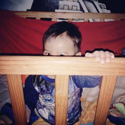 Portrait of boy relaxing on seat