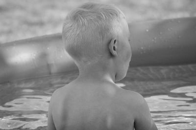 Full length of shirtless boy in swimming pool