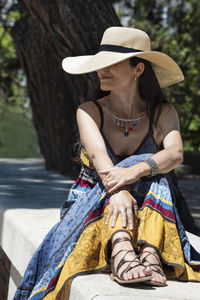 Full length of woman sitting in park