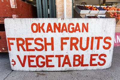 Warning sign on street market