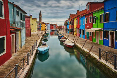 Boats moored in canal