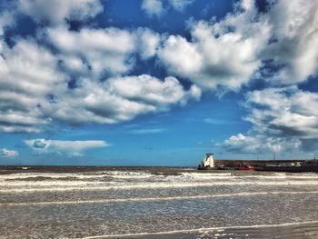 Scenic view of beach against sky