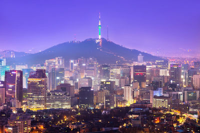 Illuminated buildings in city at night