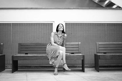 Beautiful lady sitting on a bench