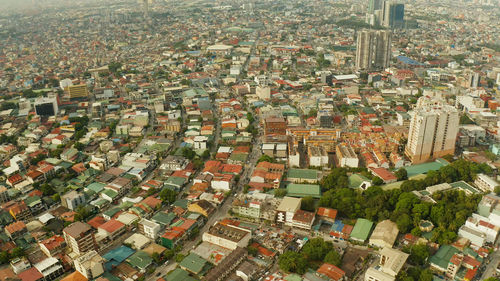 Manila city view from above with streets and buildings in the makati business center.. 