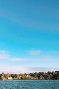 Scenic view of sea against blue sky