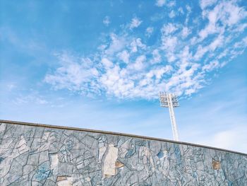 Low angle view of communications tower against sky