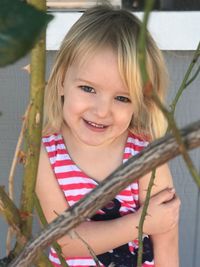 Portrait of happy girl playing outdoors