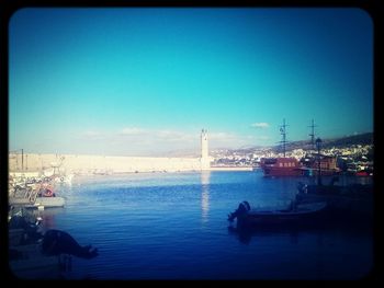 View of harbor against blue sky