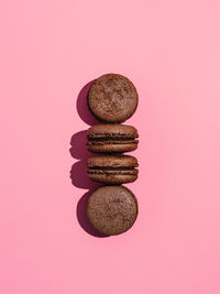 Close-up of cookies against pink background