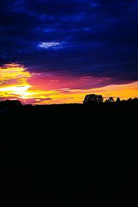 Silhouette landscape against sky during sunset