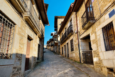 Alley amidst buildings in city