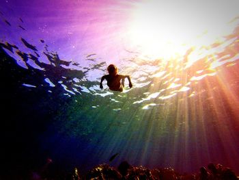 Low angle view of woman swimming underwater