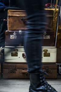 Blurred motion of man walking against suitcases