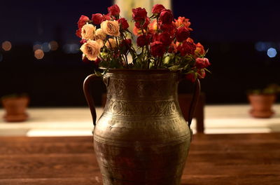 Close-up of flower vase on table