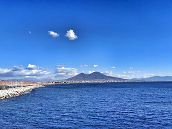 Scenic view of sea against blue sky