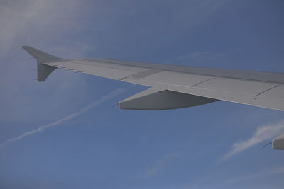Low angle view of airplane flying in sky