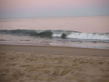 Scenic view of beach against clear sky