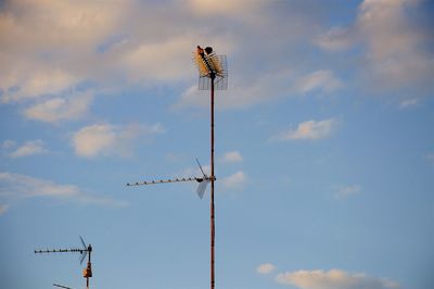 Low angle view of wind turbine against sky