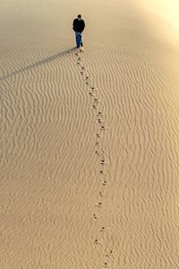 High angle view of man on sand at beach