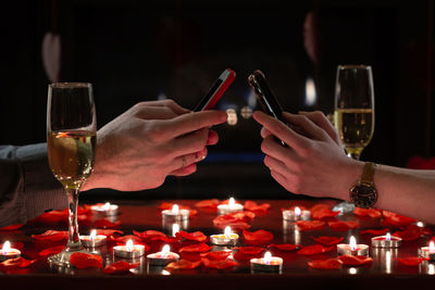 Close-up of wine glasses on table