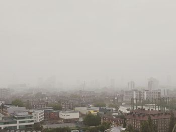 High angle view of buildings in city against sky